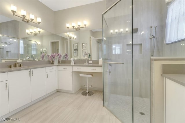 bathroom featuring vanity and an enclosed shower