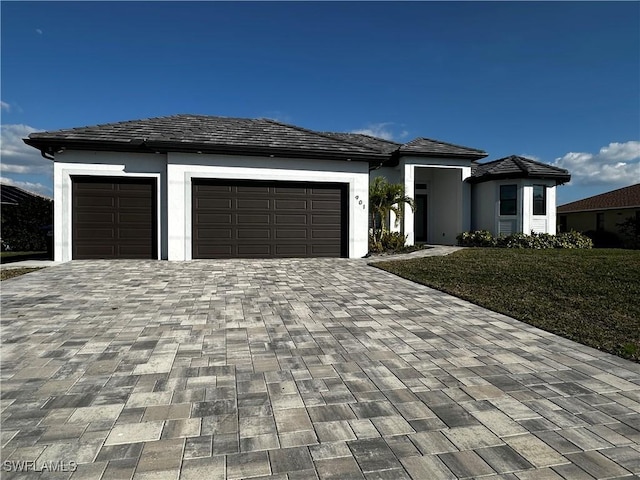 prairie-style home featuring a garage