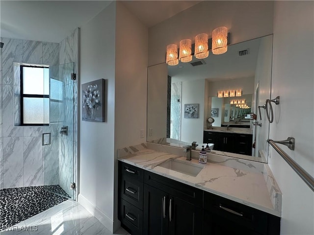 bathroom with vanity and walk in shower