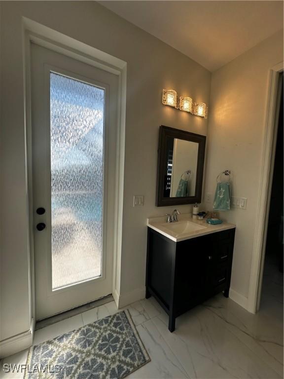 bathroom with vanity and a healthy amount of sunlight