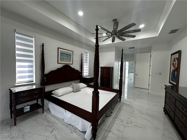 bedroom featuring crown molding, a tray ceiling, and ceiling fan