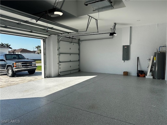 garage with a garage door opener, electric panel, and electric water heater