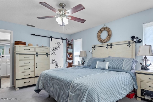 carpeted bedroom featuring ceiling fan