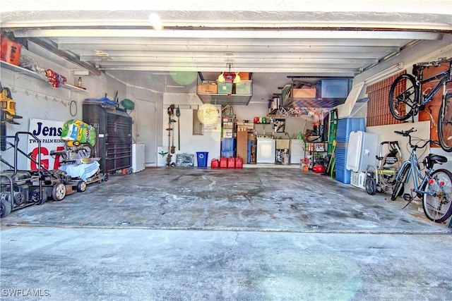 garage with washing machine and dryer