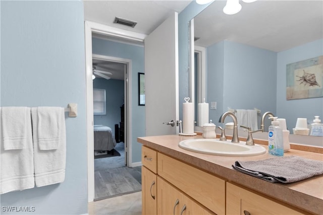 bathroom with tile patterned floors and vanity