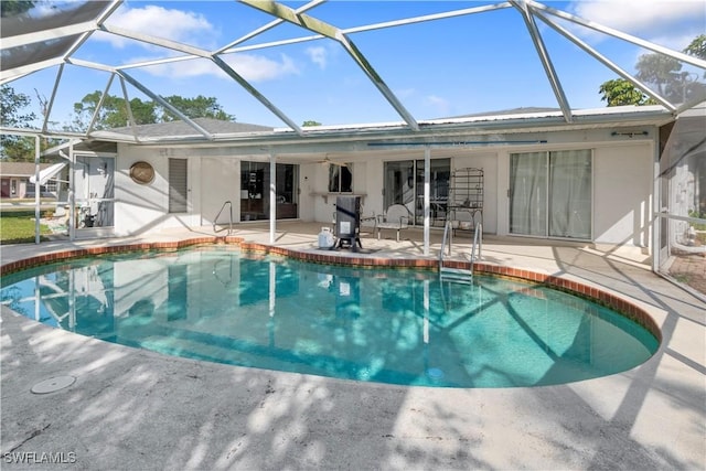 view of pool featuring a patio and glass enclosure