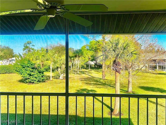 view of yard with ceiling fan