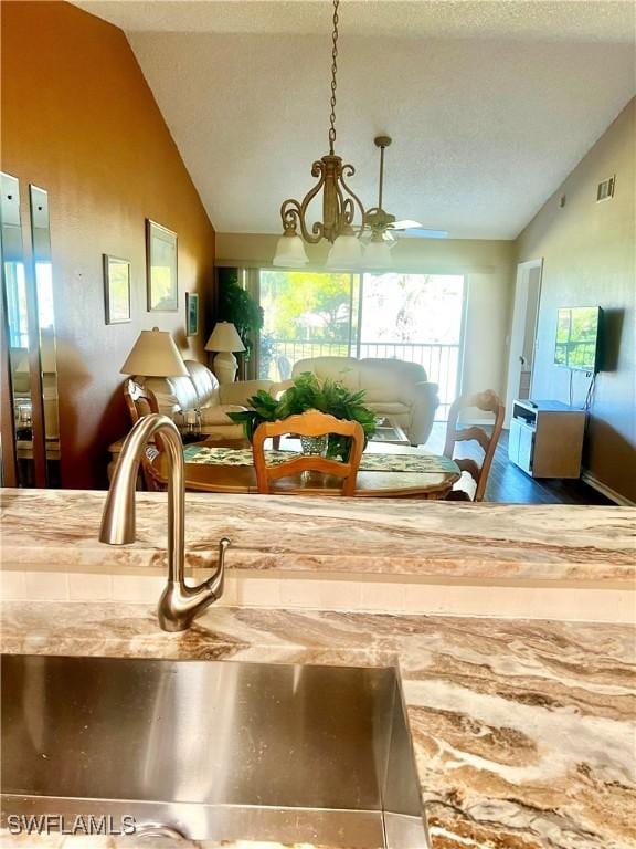 details featuring sink and a textured ceiling