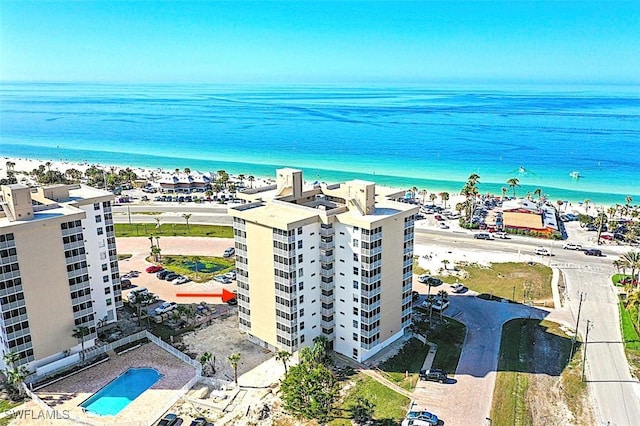 aerial view featuring a water view and a view of the beach