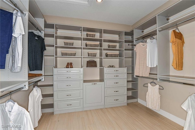 walk in closet featuring light wood-style floors