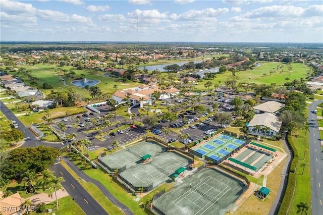 bird's eye view featuring a water view and golf course view