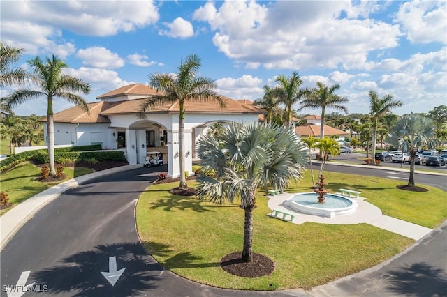 surrounding community featuring driveway and a yard