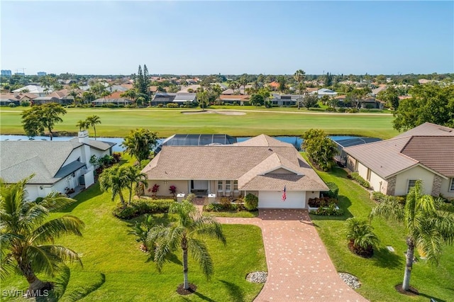 drone / aerial view with golf course view and a residential view