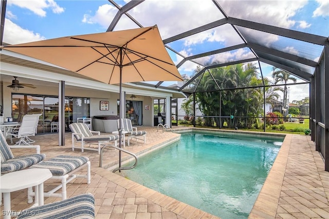 outdoor pool featuring ceiling fan, a patio area, and a lanai