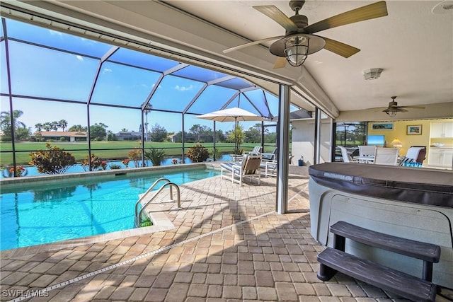 pool with a ceiling fan, outdoor dining space, glass enclosure, and a patio area