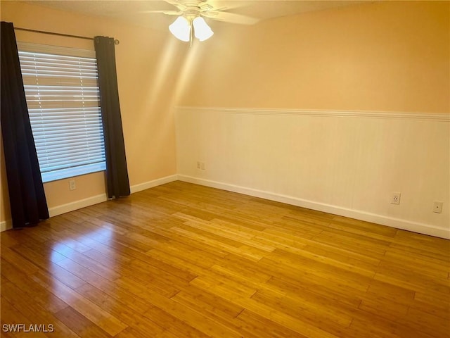 spare room featuring light hardwood / wood-style flooring and ceiling fan