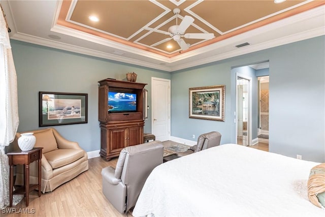 bedroom featuring ornamental molding, coffered ceiling, ceiling fan, light hardwood / wood-style floors, and ensuite bath