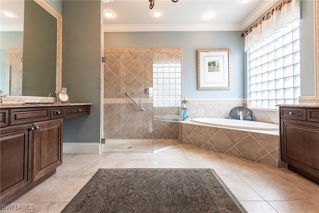 bathroom featuring tile patterned flooring, crown molding, and vanity