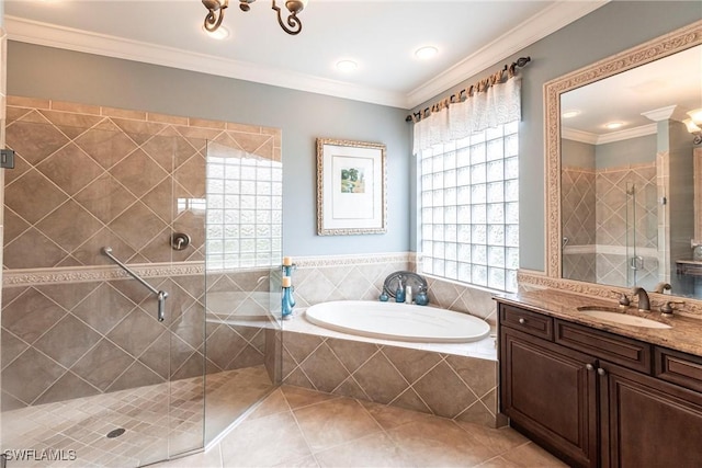 bathroom with tile patterned flooring, vanity, crown molding, and separate shower and tub