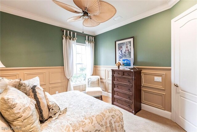 bedroom featuring ornamental molding, carpet floors, and ceiling fan