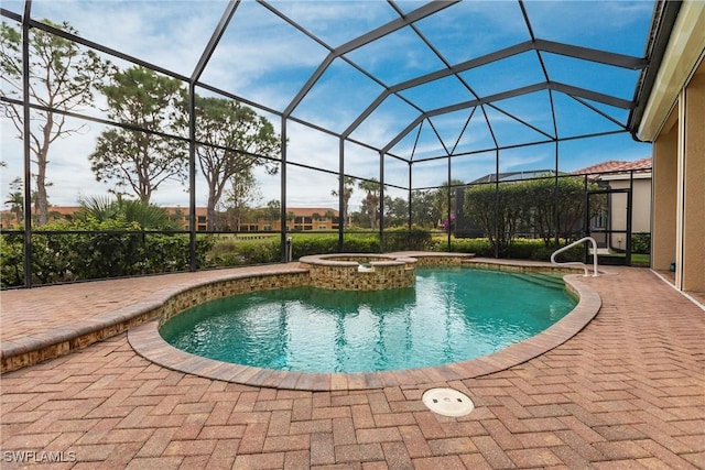 view of swimming pool with an in ground hot tub, a patio, and glass enclosure