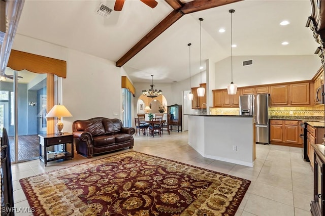 living room featuring sink, high vaulted ceiling, light tile patterned floors, beamed ceiling, and ceiling fan