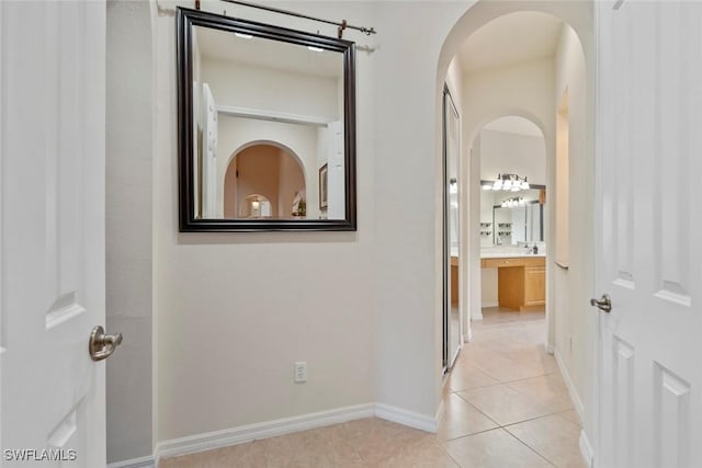 hallway with light tile patterned floors