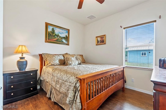 bedroom with dark wood-type flooring and ceiling fan