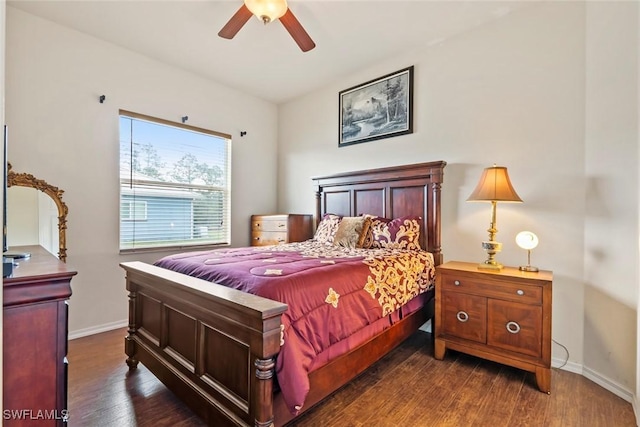 bedroom with dark hardwood / wood-style floors and ceiling fan