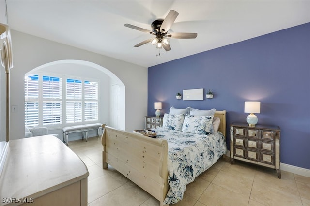 tiled bedroom with ceiling fan