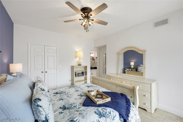 tiled bedroom featuring a closet and ceiling fan