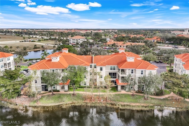 birds eye view of property with a water view