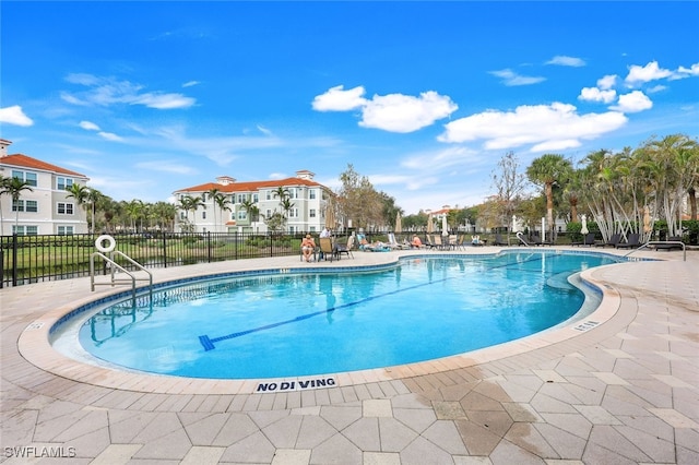 view of pool featuring a patio