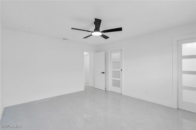 spare room with ceiling fan