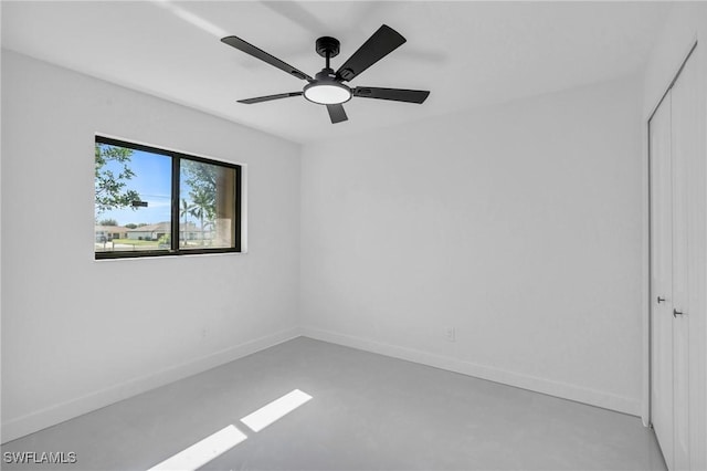 unfurnished room with concrete flooring and ceiling fan