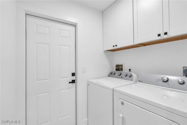 laundry area featuring cabinets and independent washer and dryer