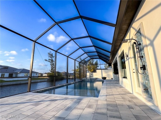 view of swimming pool with a water view, a lanai, and a patio