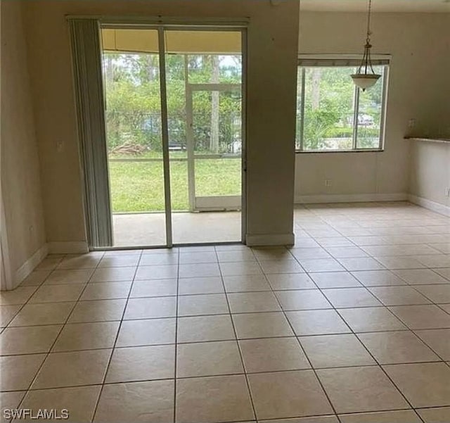 doorway to outside featuring light tile patterned floors