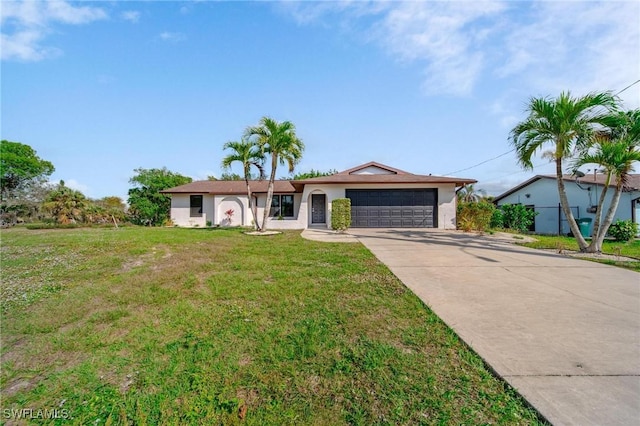 ranch-style home with a garage and a front lawn