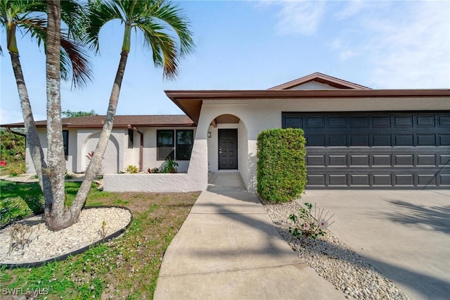 single story home featuring a garage