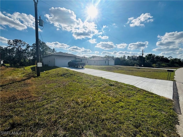 view of yard featuring a garage