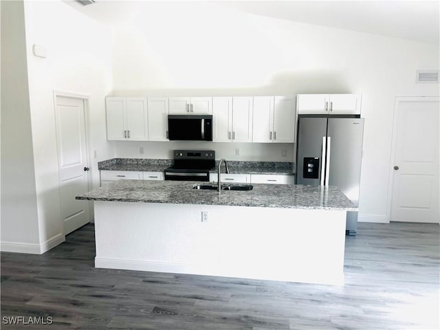 kitchen featuring sink, white cabinetry, stone countertops, a center island with sink, and stainless steel appliances