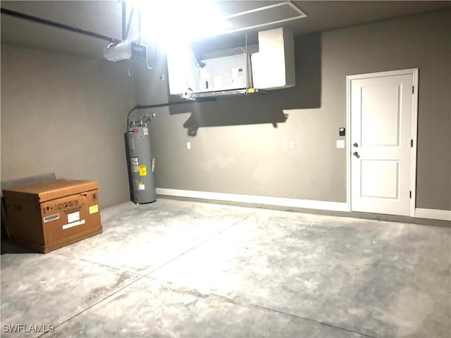 garage featuring water heater and a garage door opener