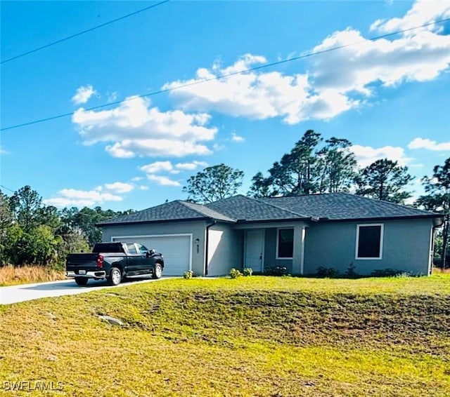 537 Greenbriar Blvd, Lehigh Acres, FL 33972 - single story home with stucco siding, a front lawn, concrete driveway, and a garage
