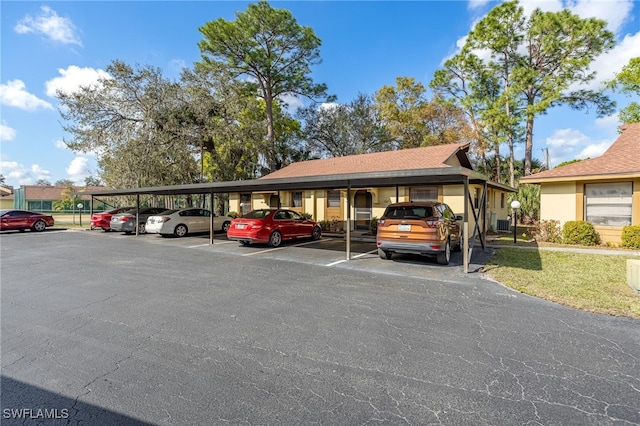 view of parking / parking lot with a carport