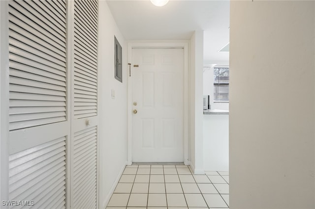 doorway to outside featuring light tile patterned floors