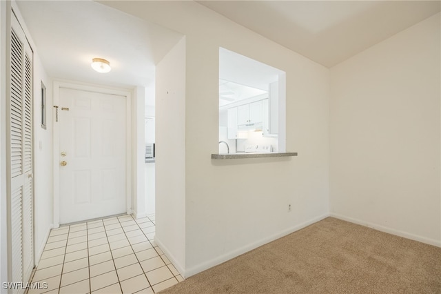 entrance foyer with light tile patterned floors