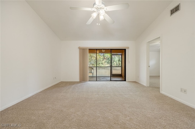 carpeted empty room featuring lofted ceiling and ceiling fan