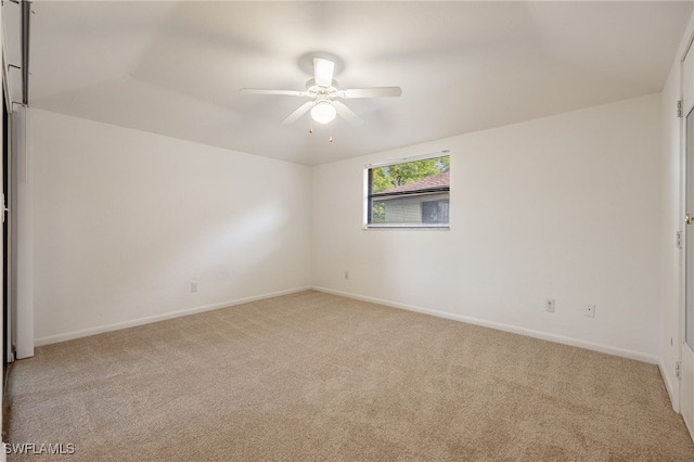 unfurnished room with ceiling fan and light colored carpet