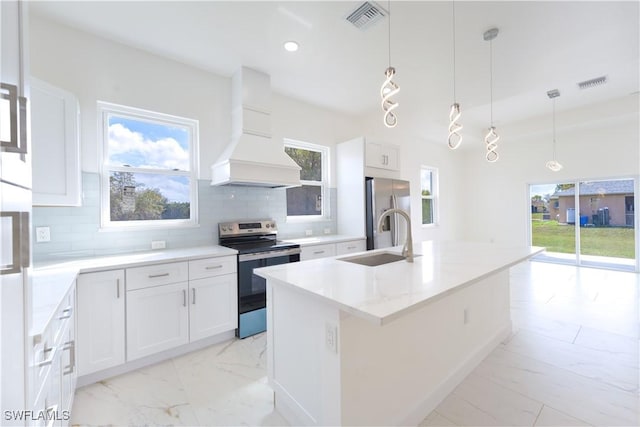 kitchen featuring sink, appliances with stainless steel finishes, white cabinets, and pendant lighting